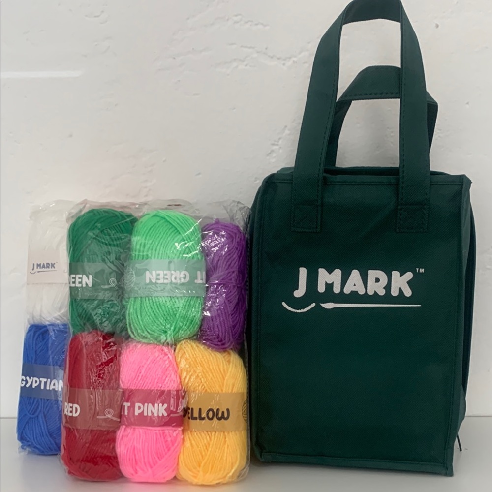 J Mark learn to crochet kit with 12 colored yards and carrying case.